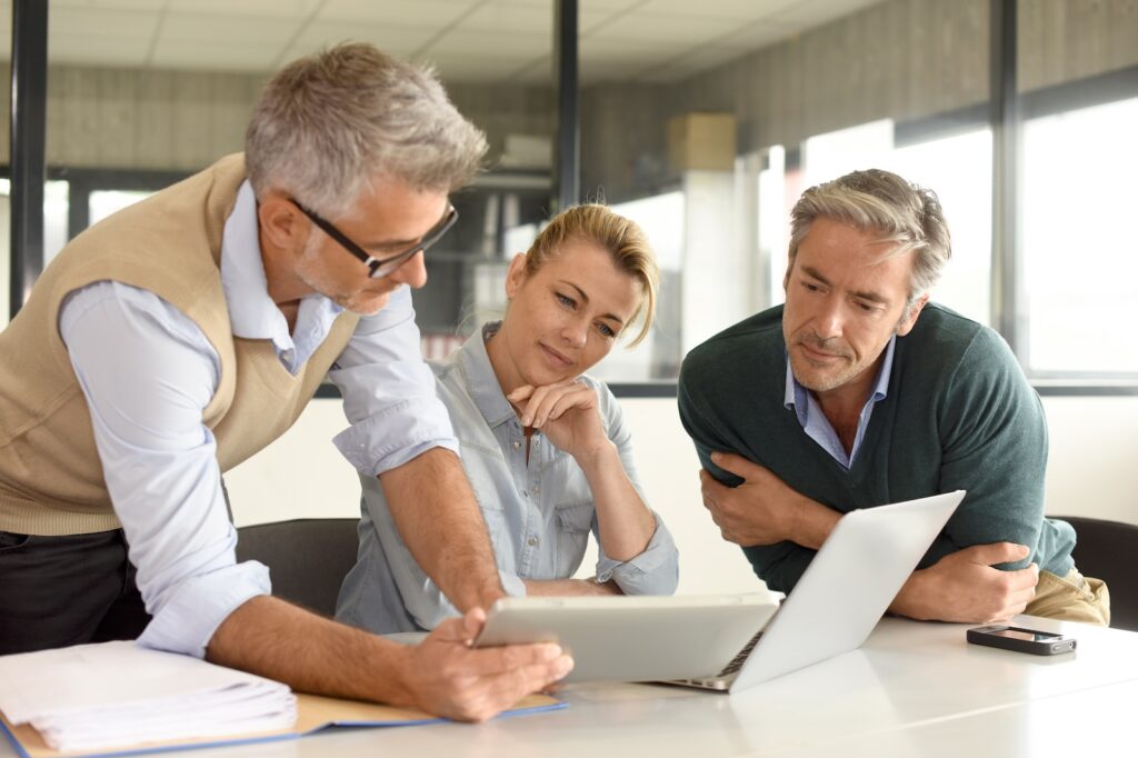 Business people in a meeting using tablet