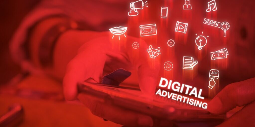 Close up of a hand using a phone and seeing digital advertising
